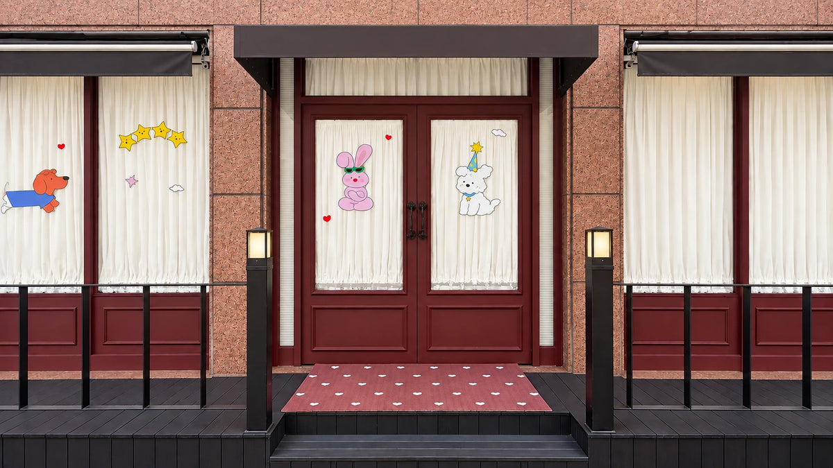 Front doors of the BunnyPuppy boutique with cheerful dog illustrations